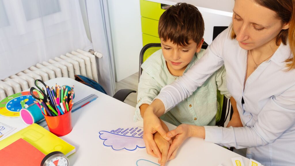 What Is the Y-BOCS Scale? Understanding Autism and OCD Child completing an activity with a professional during an assessment