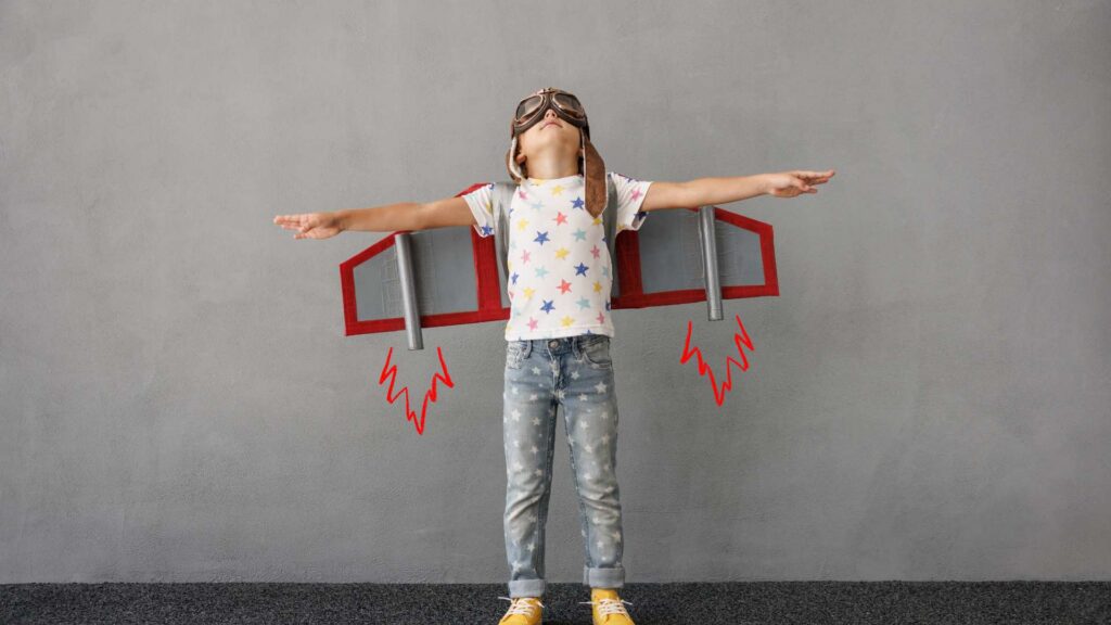 What Parents Wish They Knew About Having a Child with Autism Child pretending to fly with a homemade cardboard airplane costume