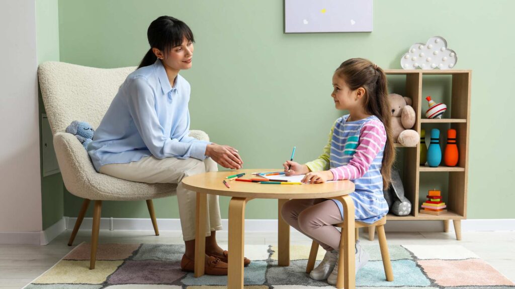 ABA therapist working one-on-one with a child during an individualized therapy session