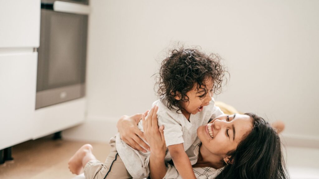Raising a Child With Autism: Navigating Your Family’s Unique Journey Mother playing and sharing an affectionate moment with her child