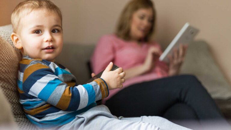 Blog Autism evaluation report. Young child with parent after an autism diagnosis